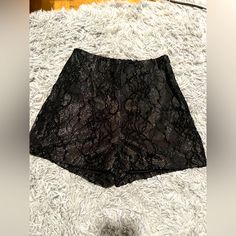 Black And Shimmer Lace Shorts. Never Worn. Size Small With Zipper In The Back. Smoke Free Home And No Tearing. Black Short Bottoms For Evening, Black High-waisted Shorts For Party, Black Summer Evening Shorts, Black Shorts For Evening With Short Length, Black Shorts For Evening, Short Length, Black Evening Shorts, Chic Black Evening Shorts, Elegant Black Shorts For Going Out, Elegant Black Shorts For Date Night