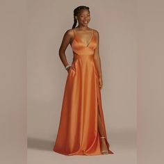 Satin A-Line Prom Dress With Cutouts A Deep V-Neckline Flows Into Side Cutouts On The Bodice, Adding A Subtle Sexy Touch To This Graceful, Satin A-Line Dress. Jules & Cleo, Exclusively At David's Bridal Polyester Back Zipper; Fully Lined Hand Wash Imported (Note: Appears Bright Orange In Person) Prom Dresses Orange, Orange Prom Dress, Orange Prom Dresses, Dresses Orange, Dress With Cutouts, A Line Prom Dress, Davids Bridal Dresses, A Line Prom Dresses, Davids Bridal