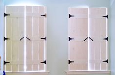 two windows with white shutters are shown in the same room as each other,