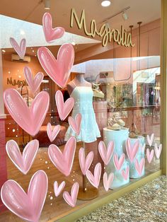 a display window with pink hearts in it