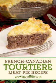 a piece of french - canadian meat pie on a plate with a fork next to it