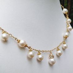 This romantic white pearl necklace is handmade with perfectly polished natural freshwater pearls and just enough sparkly Swarovski crystal accents. Expertly hand wire wrapped with 14k gold filled wire, chain and clasp. A gorgeous statement necklace for a blushing bride on her wedding day. A thoughtful gift for a woman born in June since her birthstone is the precious pearl.Necklace Details:- Necklace Length is 18 inches (43.18 cm) plus a 1 inch extender for the perfect fit- The central pendant l Elegant Pearl Wire Wrapped Necklaces, Elegant Wire Wrapped Pearl Necklace, Formal Wire Wrapped Pearl Jewelry, Elegant White Wire Wrapped Necklace, Pearl Wire Wrapped Necklace For Wedding, Wire Wrapped Pearl Necklace For Wedding, Wedding Pearl Necklace With Wire Wrap, Exquisite Pearl Necklace For Anniversary, Pearl White Akoya Pearl Bridal Necklace