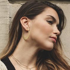 W H A T ∙ M A K E S ∙ T H I S ∙ S P E C I A L A crescent-shaped take on the classic hoop earring that draws influences from both tribal and 1970s jewellery. The half moon shapes are cut from on-trend raw silver giving them their slightly matte gold finish. Try pairing these crescent moon earrings with jeans and a loose t-shirt for a casual festival feel. Simple, delicate and versatile... you'll want in your collection. - we use only the finest quality materials - all components are 100% sterling silver or 18k Gold plated  (Nickel free) - all pieces are designed in our happy studio D E T A I L S * Hoops measure 40mm in diameter *  Available in sterling silver or Crafted in Gold plated .925 sterling silver * Price is per pair  * Very easy to put on  All jewelry comes in beautiful packaging, 1970s Jewelry, Hoop Earrings Large, Casual Festival, Gold Crescent Moon, Crescent Moon Earrings, Hoop Earrings Gold, Gold Moon, Moon Shapes, Silver Prices