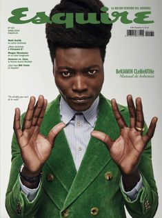 the cover of esqure magazine with an african man in a green suit