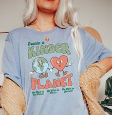 CREATE A KINDER PLANET. There is no Planet B! We love Bella + Canvas tees! A Unisex tee that's a perfect fit for every body. Soft and lightweight crewneck that fits like a well-loved favorite. ❤ If you would like the oversized fit look, please purchase a size 2 times larger than your regular size. ❤ ✦ PRODUCT INFO ✦ ▸ All items are printed just for you using water based eco-friendly & biodegradable inks.  ▸ 100% ring-spun cotton.  ▸ Sewn-in label. ▸ Please note: Colors may differ slightly in person than on a monitor or phone. ✦ CARE INSTRUCTIONS ✦ ▸ Machine wash cold, inside-out on a gentle cycle with a mild detergent and like colors. ▸ Tumble dry on low. ▸ Do not bleach and do not iron directly on design. ✦ SHIPPING TIMES ✦ Our products are processed & printed just for you when you order! Casual Text Print Tops For Earth Day, Earth Day Text Print Crew Neck Top, Earth Day Letter Print Crew Neck Top, Casual Screen Print Tops For Earth Day, Letter Print Crew Neck Top For Earth Day, Casual Tops With Earth Day Screen Print, Relaxed Fit Letter Print Tops For Earth Day, Casual Graphic Print Shirt For Earth Day, Casual Shirt With Graphic Print For Earth Day