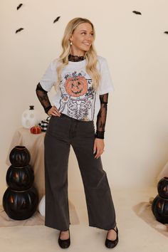 Get ready for a brew-tiful fall season with THE PUMPKIN COFFEE TEE IN ASH! This fun and quirky tee features a playful Jack-O-Lantern design and is perfect for coffee lovers. Super cute and full of fall vibes, it's the must-have addition to your wardrobe. Paired with THE SAYLOR WIDE LEG JEANS IN BLACK & THE LOLLI LACE BALLET FLAT IN BLACK Jack-O-Lantern coffee design Printed on Bella Canvas Tee Round neck Short sleeves 99% cotton, 1% polyester Runs true to size. Small (0-4), Medium (6-8), Large (