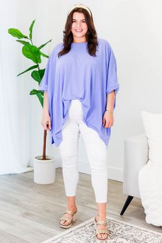 No need to compare this cutie, this is the perfect top for you! The comfy, flowy fit makes this tunic a go-to for comfort and style! Plus, the gorgeous lavender color adds a touch of sass to any outfit! Expertly crafted for ultimate comfort and style! 100% Cotton Oversized Purple Tops For Layering, Lavender Top For Layering In Fall, Lavender Tops For Fall Layering, Lavender Top For Fall Layering, Flowy Short Sleeve Tops For Loungewear, Spring Oversized Purple Tops, Purple Relaxed Fit Crew Neck Blouse, Oversized Purple Tops For Spring, Lavender Tops For Spring Layering