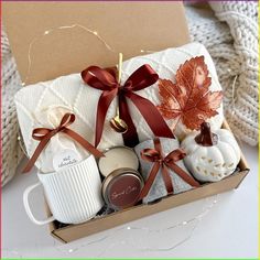 a gift box filled with coffee, cookies and other items for someone's special occasion