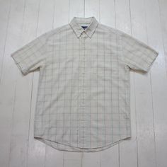 2000s/2010s Arnold Palmer Windowpane Seersucker Button Down Short Sleeve Shirt Size M/L condition - very good - tiny mark tagged M - fits oversized - please consult measurements  22" pit to pit  30.5" length    Please contact us if you have more questions about this garment. White Yarn-dyed Short Sleeve Shirt, Classic Plaid Cotton Short Sleeve Shirt, Classic Cotton Short Sleeve Plaid Shirt, Arnold Palmer, Button Down Short Sleeve, Button Down, Short Sleeve Shirt, Sleeve Shirt, Button Downs