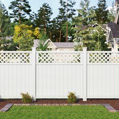 a white fence in front of a house