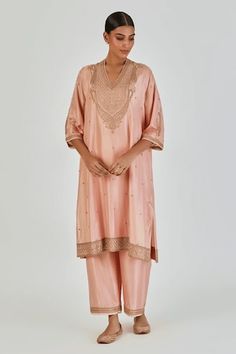 Salmon pink three fourth sleeves A-line silk kurta with paisley gul Marodi embroidery using gold zari thread work on the yoke and buta detailing. Paired with an embroidered hem palazzo. - Aza Fashions Elegant Kurta With 3/4 Sleeve For Eid, Elegant Kurta With 3/4 Sleeves For Festive Occasions, Elegant 3/4 Sleeve Kurta For Eid, Elegant Festive Set With 3/4 Sleeve, Elegant Festive Sets With 3/4 Sleeve, Elegant Holiday Set With 3/4 Sleeves, Kurta With Palazzo, Embroidered Hem, Silk Kurta