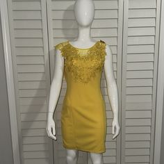 It Is New With Tags And Is Stunning On, Great For Summer Dress, Easter Dress, Spring Dress, Beach, Vacation, Boho, Casual, Date Night, Brunch Dress, Yellow Dress, Mini Dress Short Yellow Sleeveless ,Back Zipper ,Sundress With High Neck Line And Fitted Waste. Goes Well With Brown, Black, Gold, Sandal Dress Has Never Been Worn, Just Sitting In The Closet Back Zipper W/ Open Close Button Please See Attached Condition: Excellent , Brand New ,Tag 95%Polyester, 5%Spandex Measurements: Chest Is Approxi Elegant Yellow Sleeveless Mini Dress, Elegant Yellow Mini Sleeveless Dress, Fitted Sleeveless Mini Dress With Lace Trim, Fitted Sleeveless Dress With Lace Trim, Yellow Sleeveless Midi Dress For Party, Sleeveless Stretch Bodycon Dress With Lace Trim, Summer Sheath Mini Dress With Lace Trim, Sleeveless Party Dress With Lace Trim, Sleeveless Fitted Bodycon Dress With Lace Trim