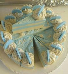 a blue and white cake sitting on top of a plate