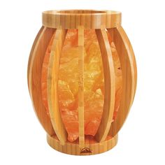 a wooden container filled with oranges on top of a white background