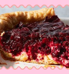 there is a piece of pie with berry toppings on the plate next to it