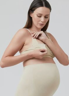 Experience unparalleled comfort and support during pregnancy and nursing with our Seamless Nursing Bra. The expertly designed knit structure and adjustable clip-release straps make breastfeeding a breeze, while the ruched front adds additional comfort and support. A must-have for expecting and new mothers. Polyamide / Elastane Clip release for nursing Adjustable straps Hook and eye closure Maternity Intimates, Breastfeeding Dress, Knit Structure, Women Nurse, Jumpsuit Outfit, Womens Maternity, Strapless Tops, Nursing Bra