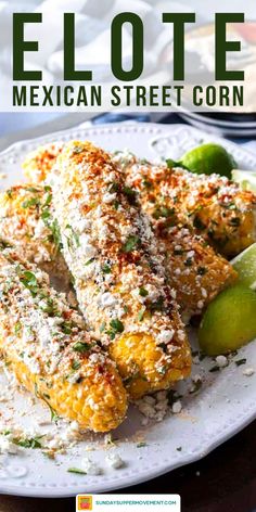 mexican street corn on a plate with limes and parmesan sprinkles