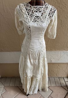 Vintage eyelet lace Edwardian era dress with overlapping front and back layer of lace. Snap style closures on one side for easy wear. Dress has been preserved and stored away for many years. Measurements taken flat, so please remember to double: armpit-armpit-17", waist-13", hips-18", side pleats are visible below region of hip to bottom of dress, top of shoulder to bottom of scalloped style edging measures-55" long. Please email with questions. Free shipping. Edwardian Era Dress, Eyelet Lace Dress, 19th Century Fashion, Edwardian Era, Eyelet Lace, Dress Top, Dress Clothes For Women, Easy Wear, 19th Century