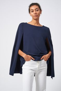 Kal Rieman Cape Sweatshirt in Navy on Model Front View Versatile Batwing Sleeve Workwear Tops, Versatile Batwing Sleeve Tops For Workwear, Fall Batwing Sleeve Tops For Workwear, Oversized Casual Cape Top, Oversized Cape Top In Casual Style, Elegant Cape Top For Spring, Elegant Spring Cape Top, Spring Casual Cape Tops, Casual Cape Tops For Spring