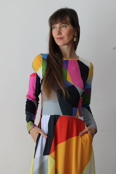 CITRINE DRESS  The original abstract print design on the dress is created by a professional artist. Colourful abstract print dress with geometrical elements, with long sleeves. Be unique. Be outstanding. Be authentic. Bright and lively colors have the power to uplift mood and instill a sense of joy. Wearing a vibrant color dress can evoke feelings of happiness and positivity, brightening not only the wearer's day but also those around her. The dress showcases an original abstract print design, where dynamic geometrical elements dance across the fabric in a symphony of colors. Bold triangles, squares, and circles intertwine, creating a visual feast for the eyes. Each element is meticulously placed to evoke a sense of movement and rhythm.  * 95% polyester, 5% elastane (fabric composition may Chic Multicolor Geometric Pattern Dress, Chic Multicolor A-line Midi Dress, Multicolor Bold Print Midi Dress, Multicolor Midi Dress With Vibrant Print, Multicolor Geometric Pattern Maxi Dress, Multicolor Abstract Print Midi Dress, Multicolor Midi Dress With Geometric Pattern, Chic Multicolor Abstract Print Maxi Dress, Chic Abstract Print Maxi Dress