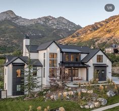 an instagramted photo of a house with mountains in the background