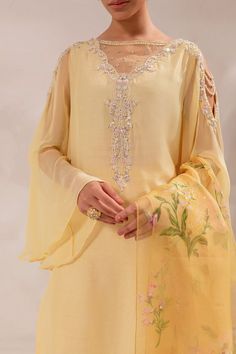 The embellished Raw Silk Pakistani Eid Dress in Yellow is an elegant choice that will win everyone's hearts at first glance with its charm. Hand-crafted details of sequins, motifs, and embroidery make this Kameez Trouser a chic choice for the festive occasion. Detailed Description: SKU: PS1830 Detailing: Embroidery, Threads, Motifs, Sequins Color: Yellow Fabric: Raw Silk, Organza Design: Fully Embroidered dress Event: Festive, Party wear Eid Outfits Pakistani, Dress Design Pakistani, Light Yellow Dresses, Outfit Muslim, Eid Outfit Ideas, Yellow Wedding Dress, Eid Dress, Dress Event, Wedding Dress Outfit