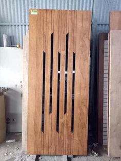 the doors are made from wood and ready to be used in an industrial building or workshop