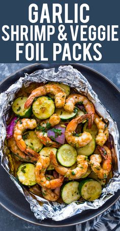 garlic shrimp and veggie foil packs on a plate