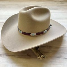 Genuine brown leather hat band decorated with silver metal conchos and turquoise colored stone. This hat band is adjustable with an attractive side buckle. Made in the USA Genuine Leather Adjustable sizing *This product is for 1 single hat band. Hat not included. Classic Cheap Hat Band One Size Fits Most, Adjustable Western Hat With Concho, Western Adjustable Concho Hat, Adjustable Concho Hats For Western-themed Events, Southwestern Adjustable Concho Hat, Adjustable Southwestern Concho Hat, Southwestern Concho Hat For Rodeo, Southwestern Style Concho Hat For Rodeo, Western Hat Bands With Concho For Curved Brim