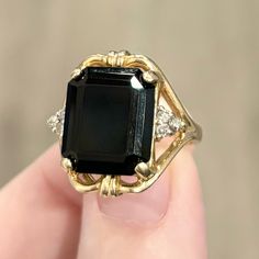 Please Note: There Are Sizing Beads On The Inside Of The Band, As Shown In The Second Photo. Stunningly Bold And Gorgeous Vintage Art Moderne (Mid Century) Style Statement Ring! Featuring A Large 14x12mm Rectangular Black Onyx, And Six 0.02 Carat I3 Clarity Diamond Accents; Set In 14k Solid Yellow Gold. The 14k Marking Is Covered Up, But The Band And Setting Acid Tests As Solid 14k Gold. This Ring Is Approximately A Size 6.25 This Ring Weighs 5.41g This Ring Measures 19.5mm From The Front; And 2.25mm From The Back Of The Band. Vintage Condition: Good (Minor Wear On The Band And Setting; Very Minor Wear On The Stone). Onyx Is A Captivating Black Gemstone That Is Composed Of Microscopic Vintage Onyx Ring, Onyx Signet Ring, Onyx Ring, Style Statement, Mid Century Style, Art Moderne, Solid Yellow, Signet Ring, Womens Jewelry Rings