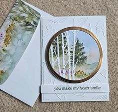 a card with an image of trees and the words you make my heart smile on it