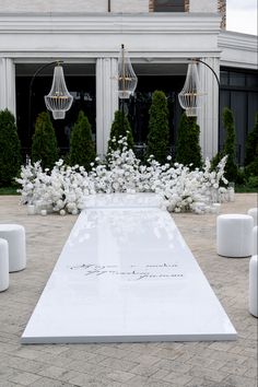 a large white table sitting in front of a building