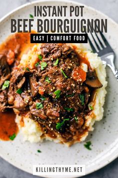 instant pot beef bourguignon on top of mashed potatoes