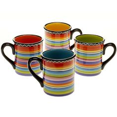 four multicolored striped coffee mugs sitting next to each other