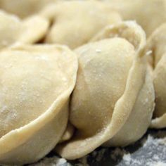 some dumplings that are sitting on a counter top and ready to be cooked in the oven