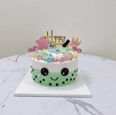 a birthday cake that is on top of a table