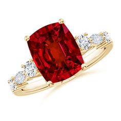 a red diamond ring with three white diamonds on the band and an oval cut stone in the center