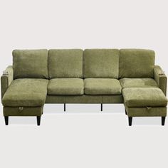 a green sectional sofa with footstool and ottoman