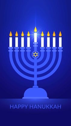 a hanukkah menorah with lit candles in the dark blue background