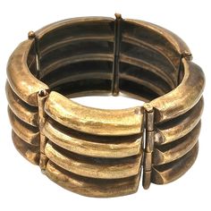 an old brass bracelet is shown on a white background