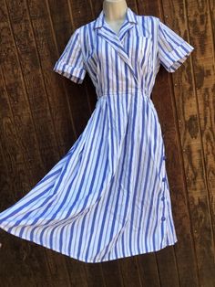 Vintage blue and white striped dress by Schrader. Labeled size 6. Good vintage condition!  Measurements taken across front laid flat 22" across front armpit to armpit waist  13" across front - stretches to 16" hips 27" 43" length Blue Vertical Stripes Dress For Daywear, Vintage Dress Blue, Blue And White Striped Dress, Antique Silver Jewelry, Vintage Blue And White, Vintage Silhouette, Beautiful Handbags, White Striped Dress, Vintage Dress