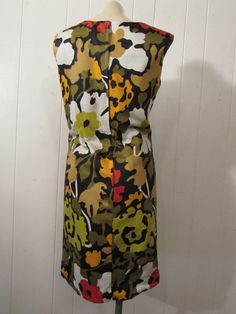 "Vintage 1960s mod dress. Made of multi color cotton. Has abstract flower pattern, back zipper and cotton lining. About a size large. Actual measurements are: 40.5\" around the bust 38\" around the waist 40.5\" around the hips 15.5\" shoulder to shoulder 37.5\" overall length In excellent unused condition. New old stock." Cotton Lined Mod Dress, Mod Style Cotton Lined Dresses, Mod Style Cotton Dress With Lining, Cotton Mod Dress With Lining, Multicolor Cotton Mod Dress, Multicolor Mod Cotton Dresses, Mod Style Multicolor Floral Print Dress, Multicolor Mod Dress With Floral Print, Mod Multicolor Floral Print Dress