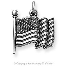 an american flag charm with a ball on it's end and a pole in the middle