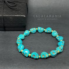 Get ready to rock and roll with this adjustable rustic turquoise skull beaded bracelet! Perfect for both men and women, this unisex wristband features medium-sized skull beads (10/8 mm) and gold metallic round beads for a unique and affordable accessory. Ideal for gothic-punk or tattoo fashion, this elastic bracelet is adjustable for a comfortable fit. Let's celebrate with some playful style and show off your love for Halloween and Day of the Dead! Need a gift for a special person? Look no further, you've found just the right one!_________________________ • GET IT FAST!Get it fast! Ready to ship on 1 to 3 business days. • ORDER NOW!Limited Quantities / Limited Edition. • FREE GIFT BOX INCLUDED!Get a Free Craft Gift Box with any order* Thank you for stopping by!_____________________________ Casual Turquoise Beaded Bracelets With Spacer Beads, Casual Jewelry With 8mm Beads For Festivals, Casual 8mm Beads Jewelry For Festival, Adjustable Skull Bracelet As Gift, Adjustable Skull Bracelets As Gift, Handmade Casual Skull Bracelets, Handmade Casual Skull Bracelet, Casual Handmade Skull Bracelets, Adjustable Handmade Skull Bracelets