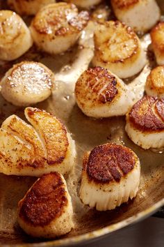 cooked scallops in a skillet ready to be eaten