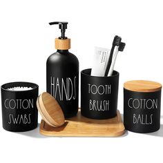 black and white bathroom accessories with bamboo holder