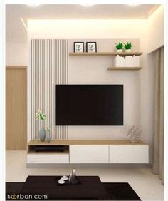 a modern living room with white walls and black table in front of the flat screen tv