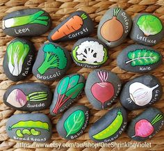 some rocks with different vegetables painted on them