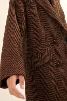 Herringbone tweed peacoat. Notch lapel collar. Two-button double-breasted closure. Side flap pockets. Chest pocket. Long sleeves. Drop shoulder. Full lining. Thigh length. Loose fit. 100% Polyester. Imported. Designed in LA. Model wears size S. This item is final sale. Brown Double-breasted Tweed Office Jacket, Office Brown Double-breasted Tweed Jacket, Tweed Outerwear With Herringbone Pattern And Suit Collar, Notch Lapel Brown Pea Coat For Fall, Brown Pea Coat With Notch Lapel For Fall, Brown Notch Lapel Pea Coat For Fall, Fall Business Tweed Jacket With Double-breasted Button, Double-breasted Tweed Jacket For Business In Fall, Winter Double-breasted Houndstooth Tweed Jacket