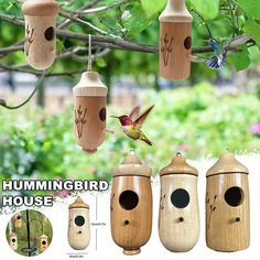 the hummingbird house is made from wood and has three birds on it's roof